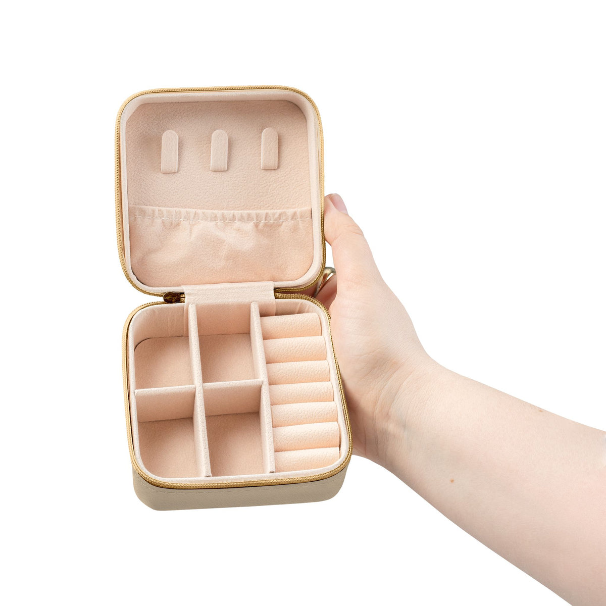 Salt & Starlight jewelry travel case in soft gold, open view showing compartments and ring rolls