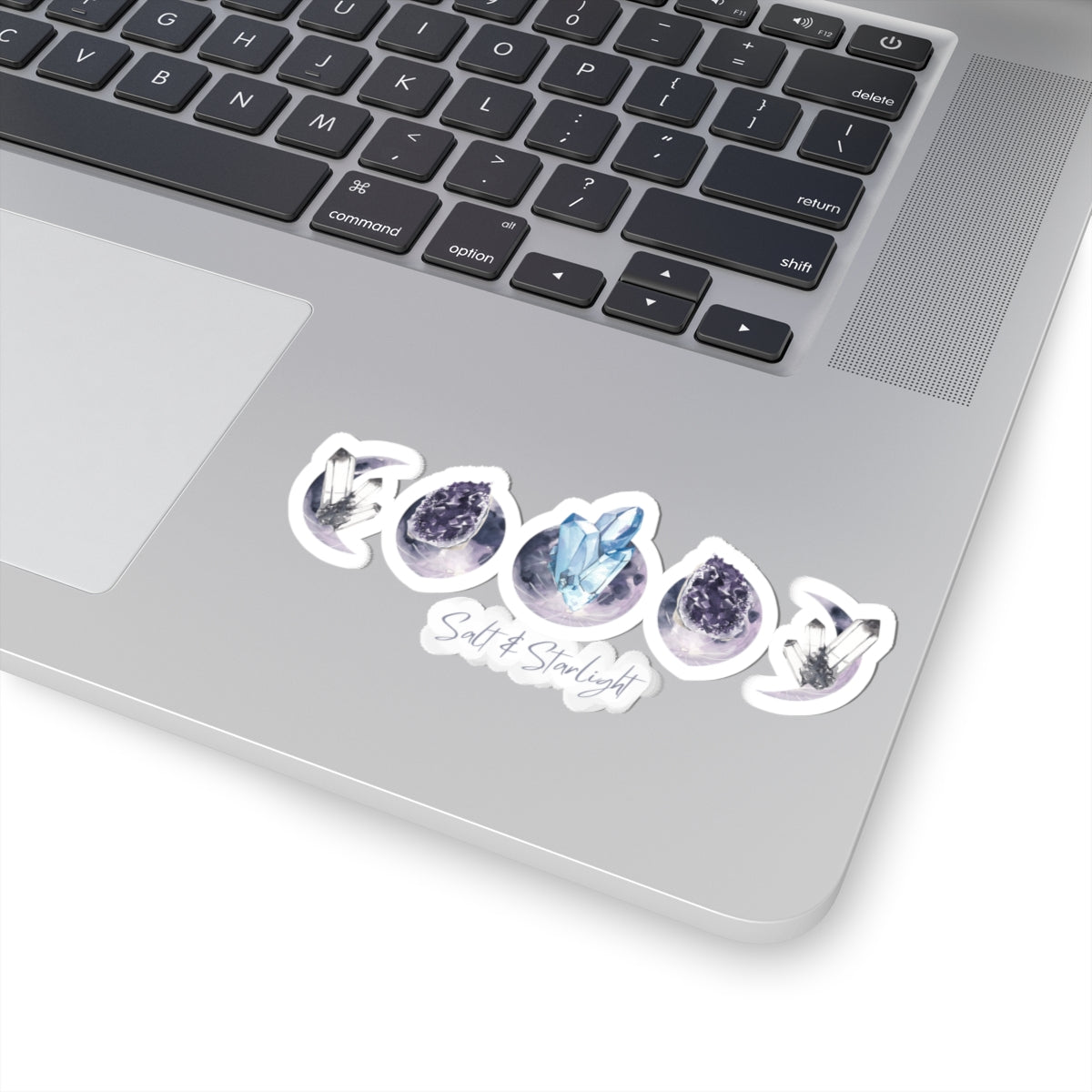 Salt & Starlight kiss-cut sticker with crystal moon phase design, shown on a laptop, alternate view
