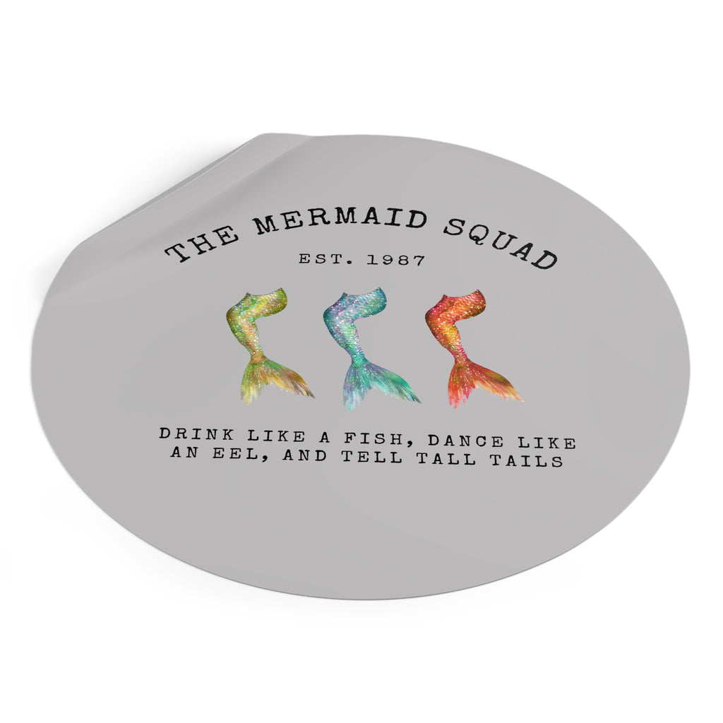 The Mermaid Squad round vinyl sticker in grey, peeling view, alternate angle