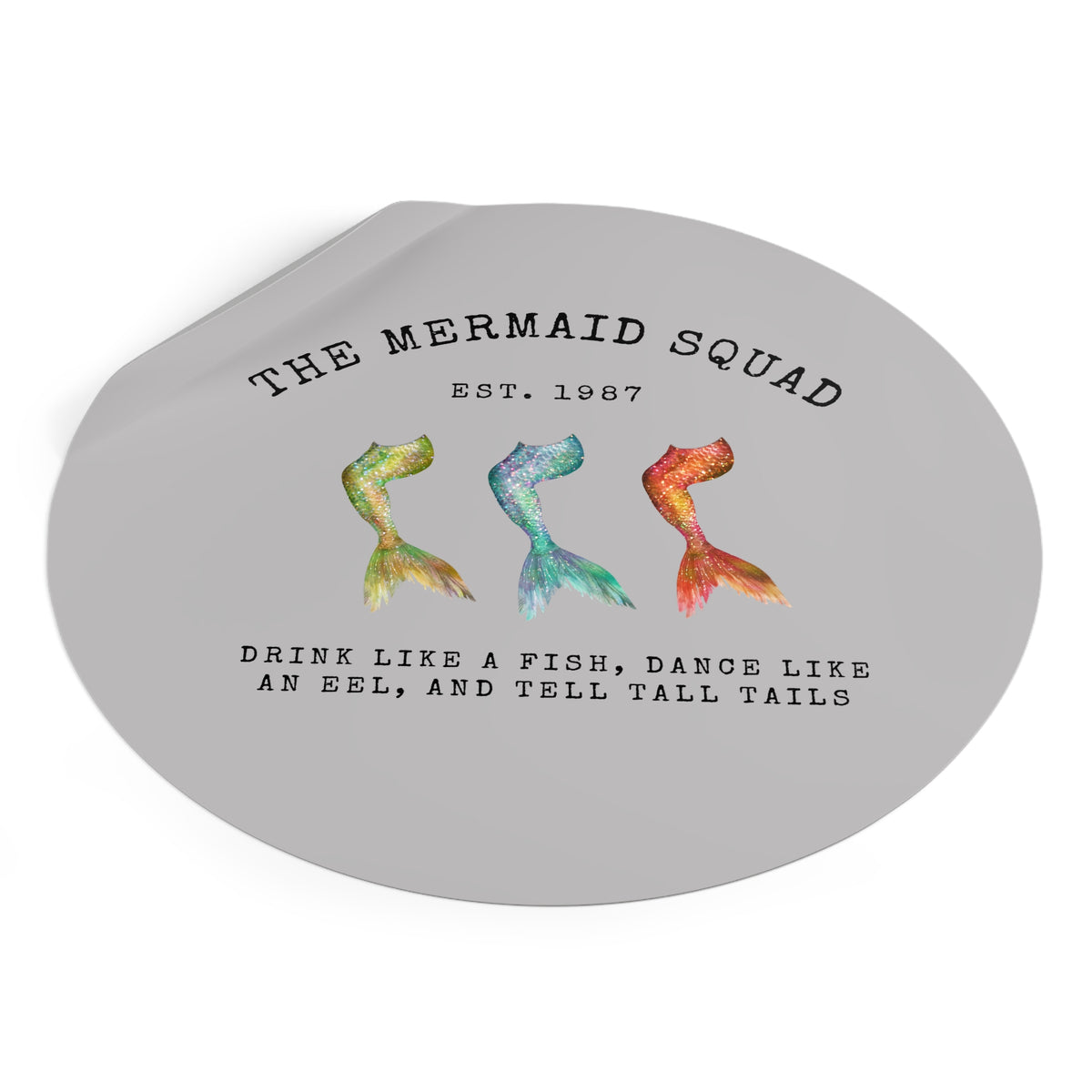 The Mermaid Squad round vinyl sticker in grey, peeling view, alternate angle