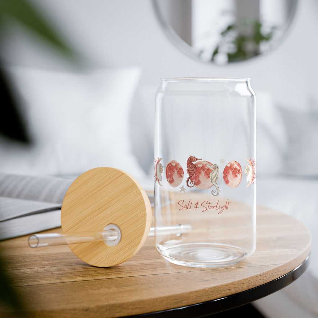 Salt & Starlight sipper glass, lifestyle view on a wooden table with the bamboo lid beside it