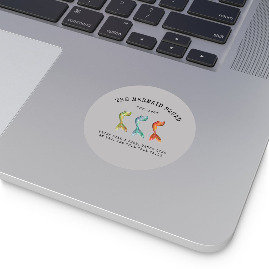 The Mermaid Squad round vinyl sticker in grey, shown on a laptop
