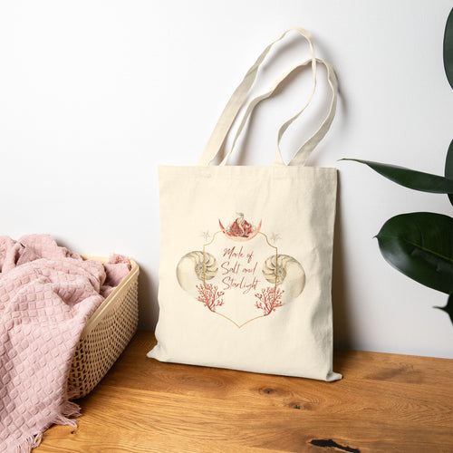 Salt & Starlight canvas tote, lifestyle view hanging beside a plant