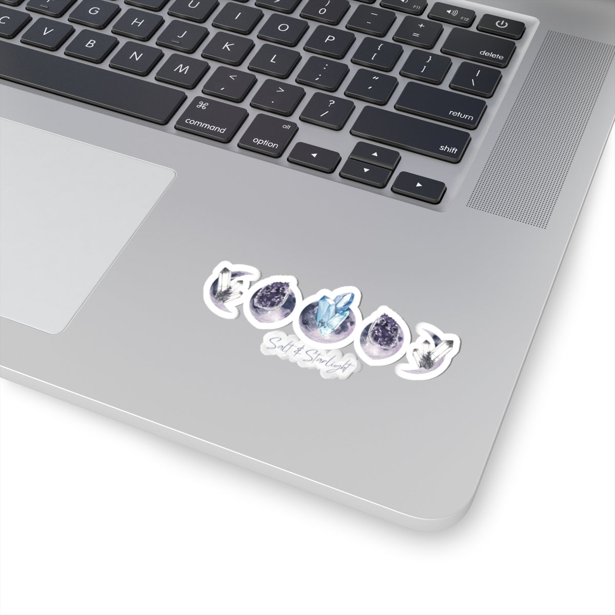 Salt & Starlight kiss-cut sticker with crystal moon phase design, shown on a laptop