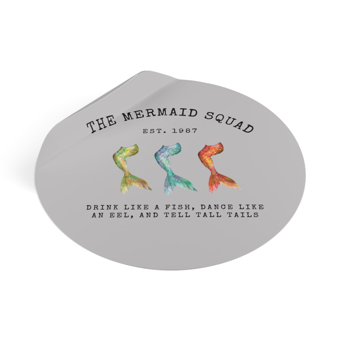 The Mermaid Squad round vinyl sticker in grey, peeling view showing the sticker lifting at the edge