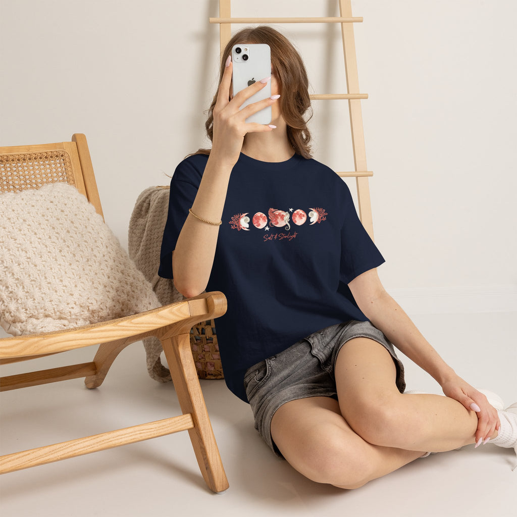 Salt & Starlight heavy cotton tee in navy, worn by a model showing the coral moon phase design