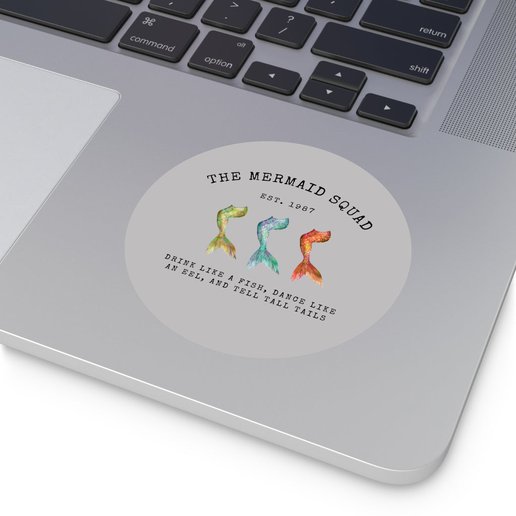 The Mermaid Squad round vinyl sticker in grey, shown on a laptop, alternate view