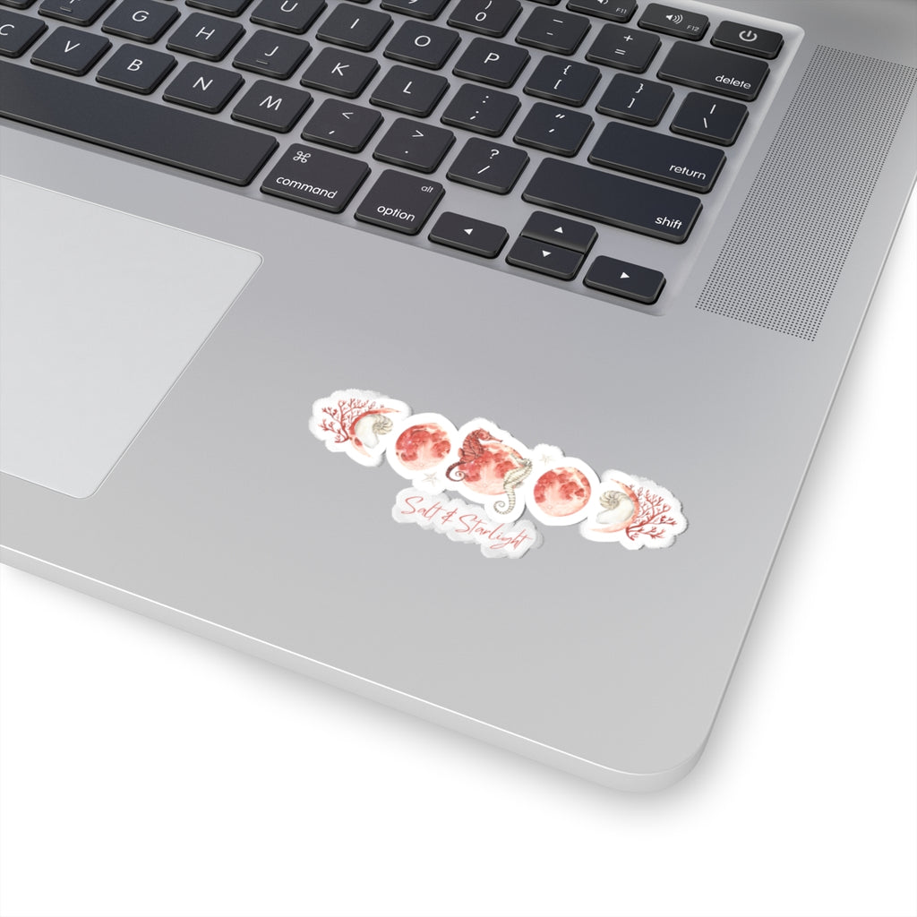 Salt & Starlight kiss-cut sticker with seahorse and coral moon phase design, shown on a laptop